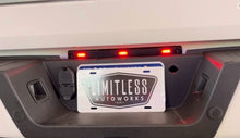 Load image into Gallery viewer, Pic of the Limitless DRW Running Light and License Plate Light Strobe/Warning/Emergency Light kit that fits 2023-Present Ford Super Duty F250/F350 Alumiduty trucks