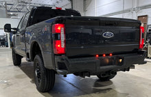 Load image into Gallery viewer, Rear/Driver side pic of the Limitless Dually Rear Bumper Running Light Plug and Play Harness that fits 2023-Present Ford Super Duty F250/F350 trucks